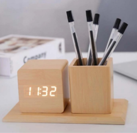 Clock with pen holder